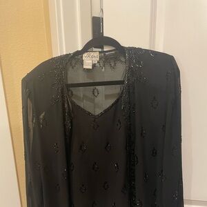 Women’s two piece black jacket with lined shell.